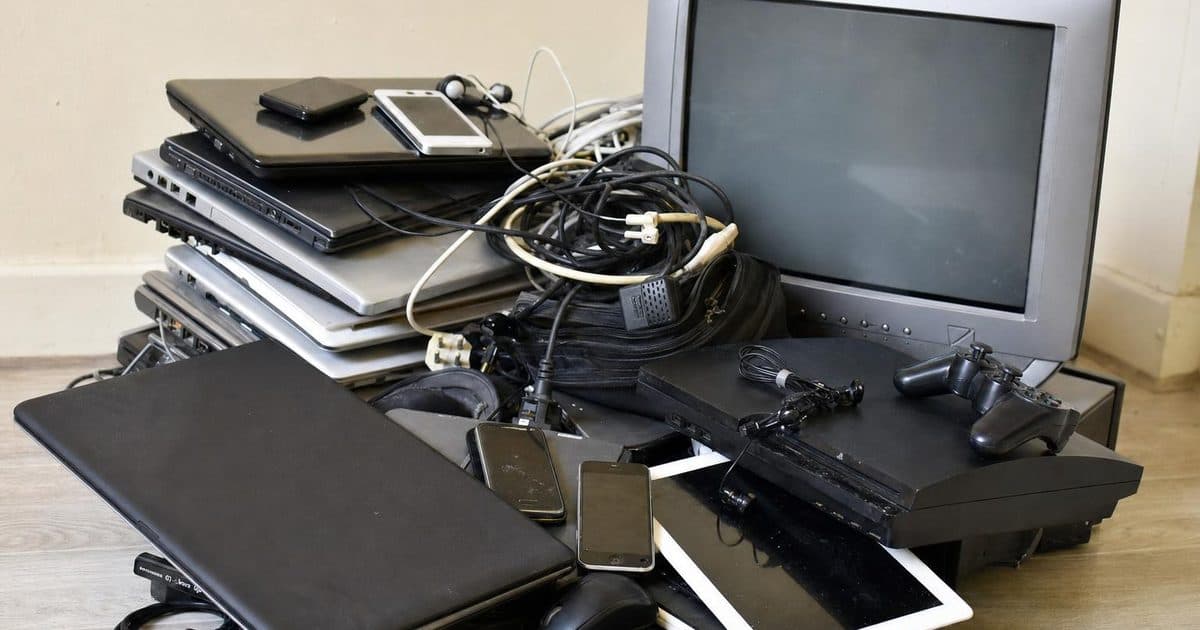 Old electronic devices and cables sorted for recycling in Salisbury